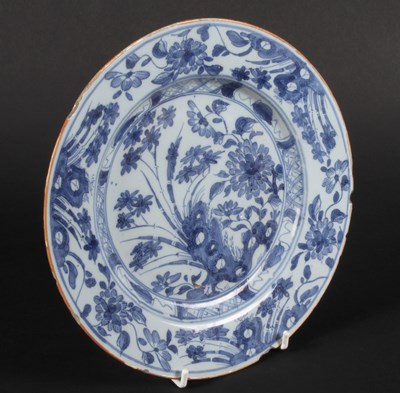 Lot 145 - An 18th century Delft blue and white plate,...