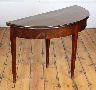 Lot 484 - A George III mahogany demi lune folding tea...