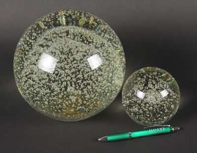 Lot 167 - A large glass bubble paperweight, together...