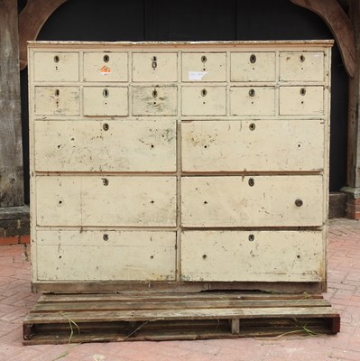 Lot 44 - An early 20th century painted pine bank of drawers