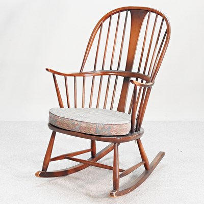 Lot 203 - A 1970's Ercol style rocking chair, with a...