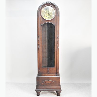 Lot 280 - An Art Deco oak cased longcase clock, with an...