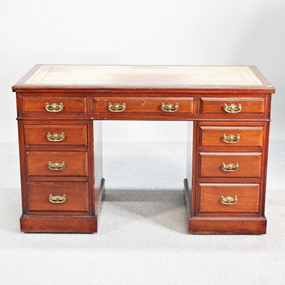 Lot 344 - An Edwardian walnut pedestal desk, with an...