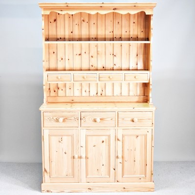 Lot 349 - A modern pine dresser, with a boarded back, on...