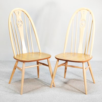 Lot 312 - A pair of modern Ercol light elm swan back...