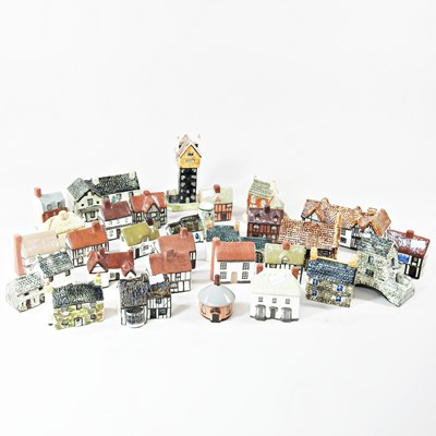 Lot 406 - A collection of novelty pottery cottages, to...