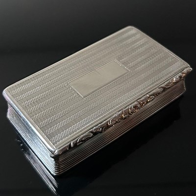 Lot 201 - A George IV silver snuff box, of rectangular...
