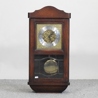 Lot 217 - A 1930's oak cased wall clock