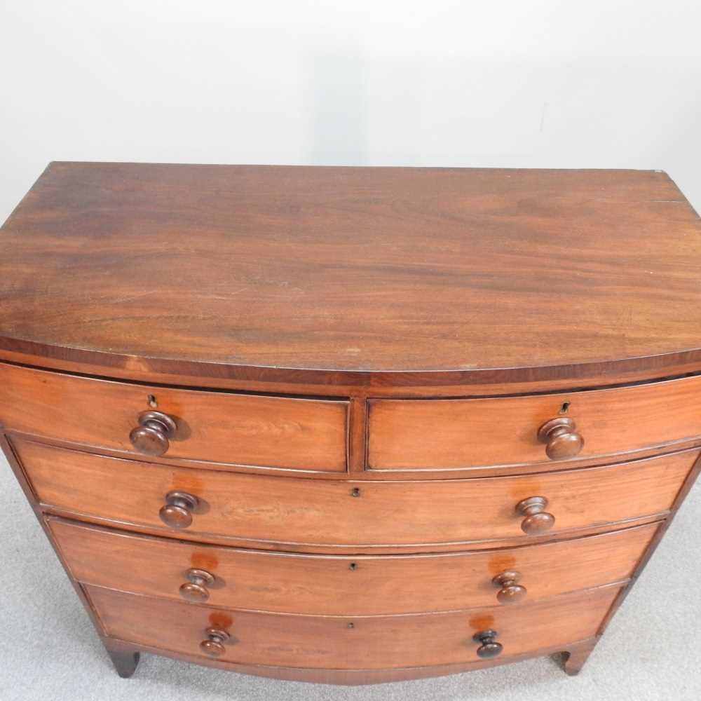 Lot 83 - A 19th century mahogany bow front chest of