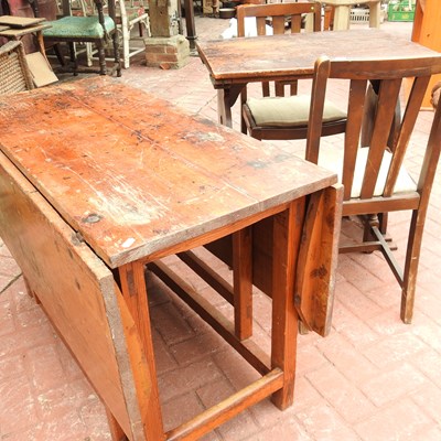 Lot 54 - An antique pine drop leaf dining table