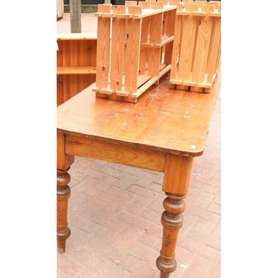 Lot 56 - An antique pine dining table