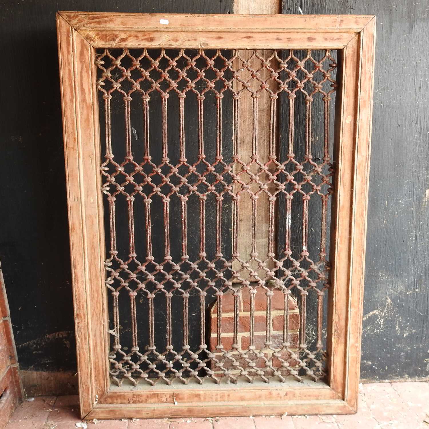 Lot 69 - An Indian hardwood window frame