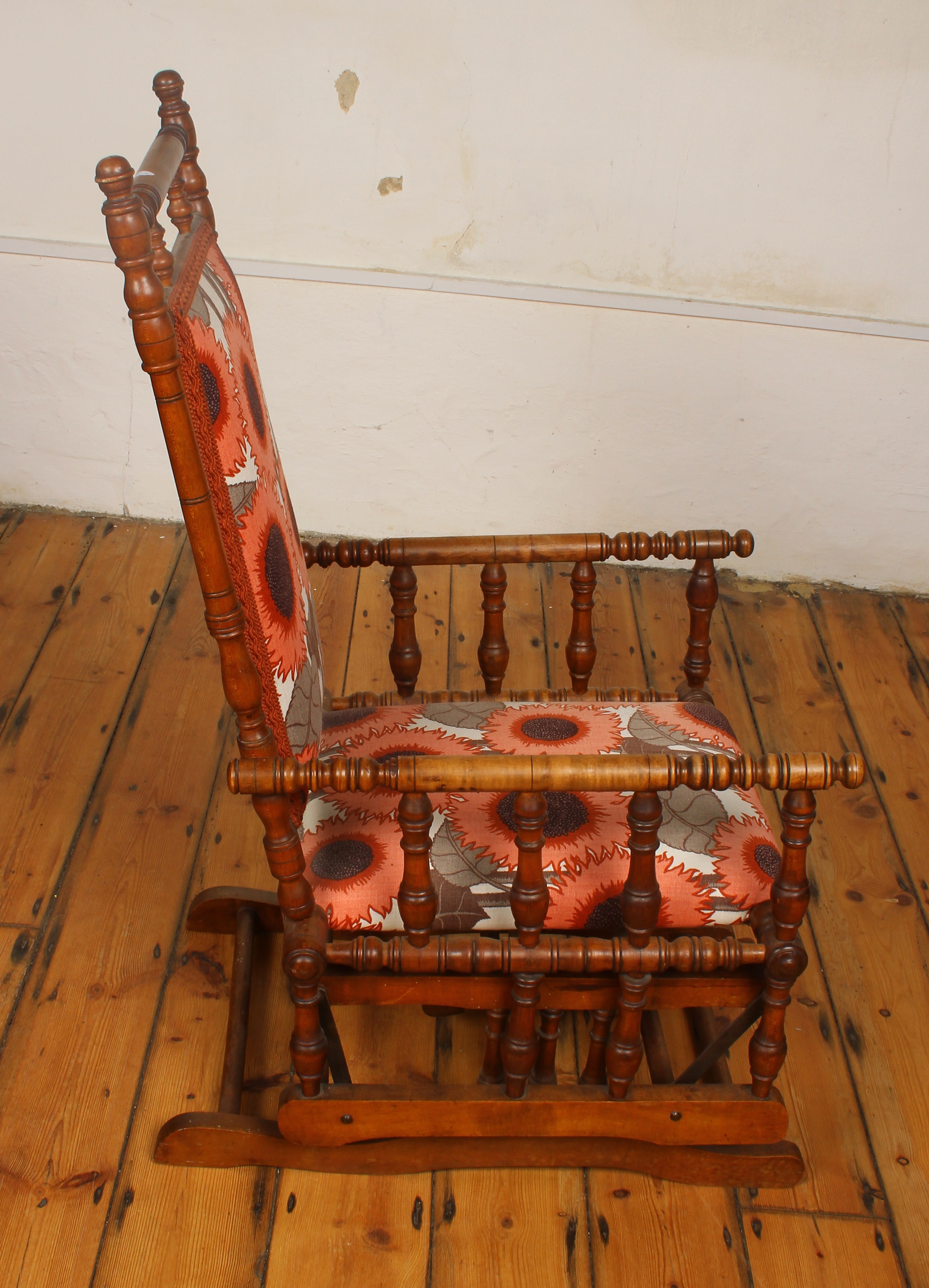 Lot 587 - A mahogany American rocking chair with