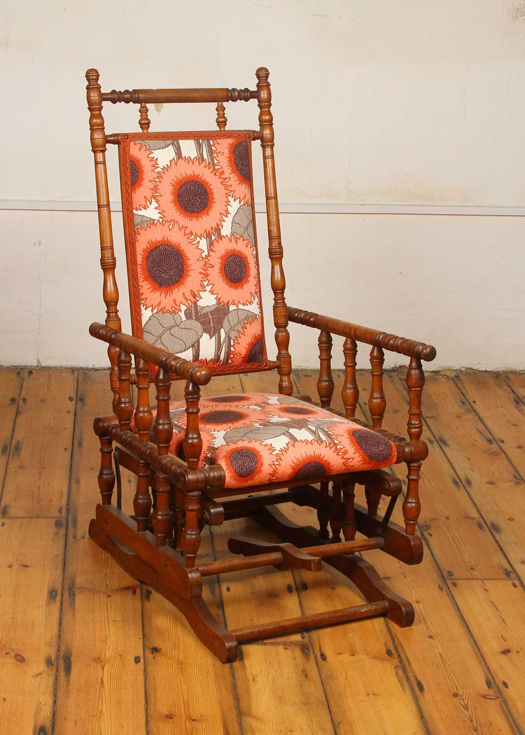 Lot 587 - A mahogany American rocking chair with