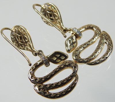 Lot 45 - A pair of 14 carat gold diamond and enamelled snake earrings