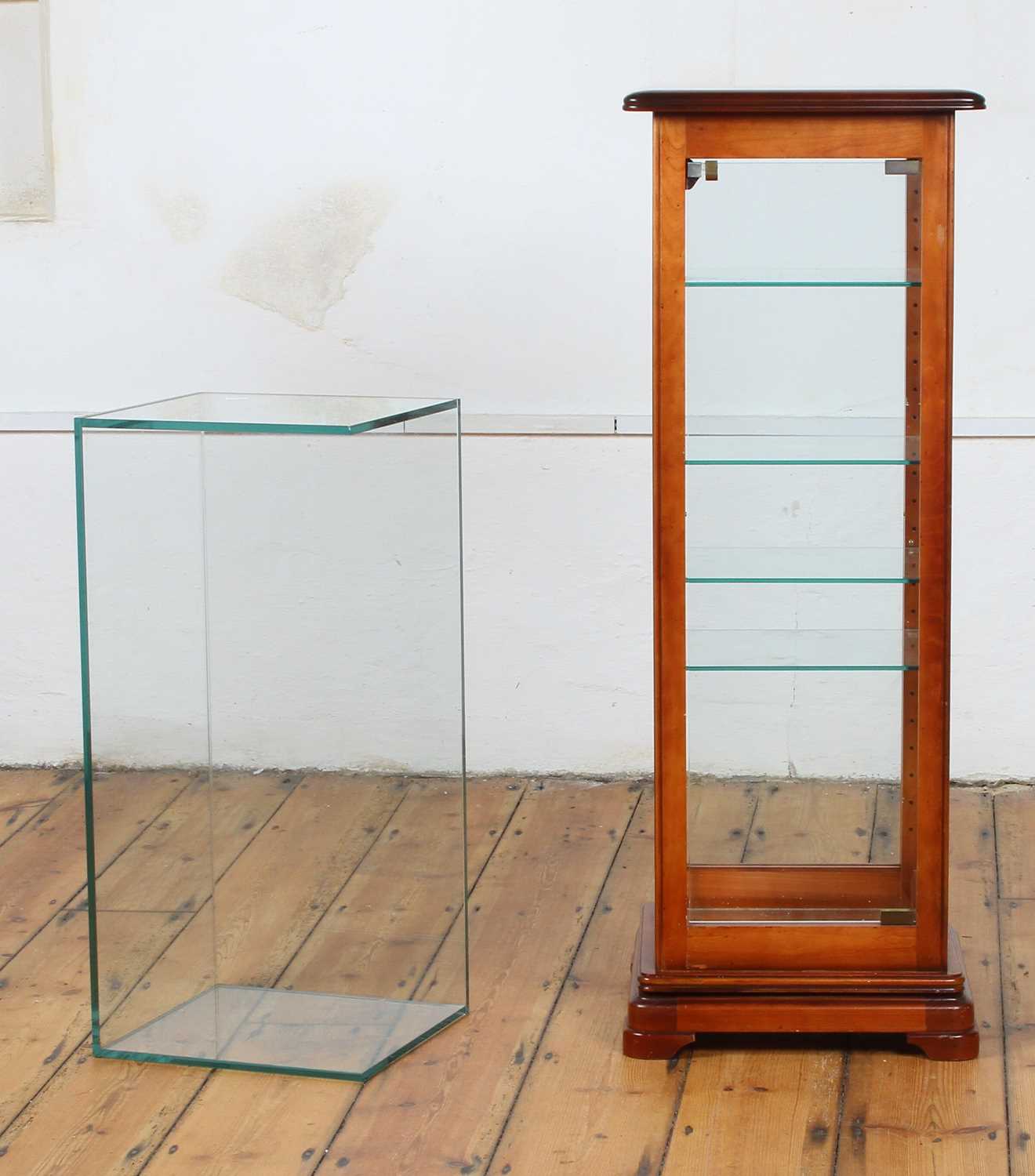 Lot 579 - A cherrywood revolving display cabinet,