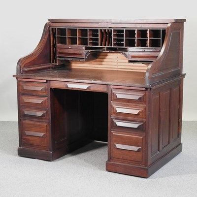 Lot 524 - A mid 20th century American walnut tambour top desk