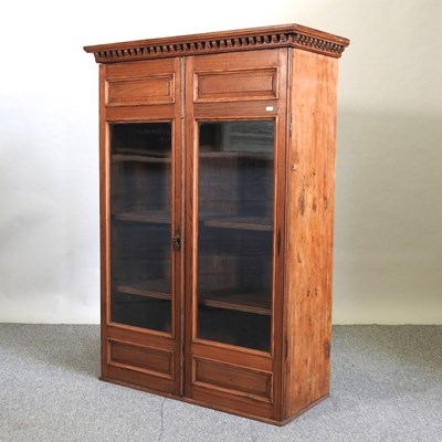 Lot 440 - An early 20th century pitch pine glazed bookcase