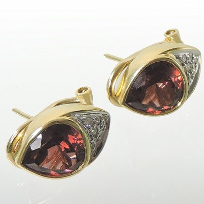 Lot 5 - A pair of 18 carat gold diamond and gem set earrings