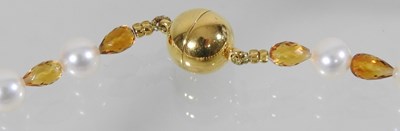 Lot 67 - A coloured cultured pearl necklace, with an 18 carat gold clasp