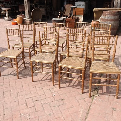 Lot 92 - A set of twelve gilt painted dining chairs