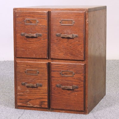 Lot 707 - An early 20th century oak filing cabinet