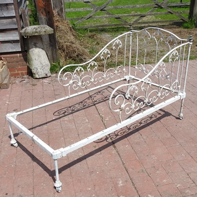 Lot 93 - An early 20th century French white painted iron day bed