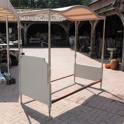 Lot 90 - A cream painted single canopy bed