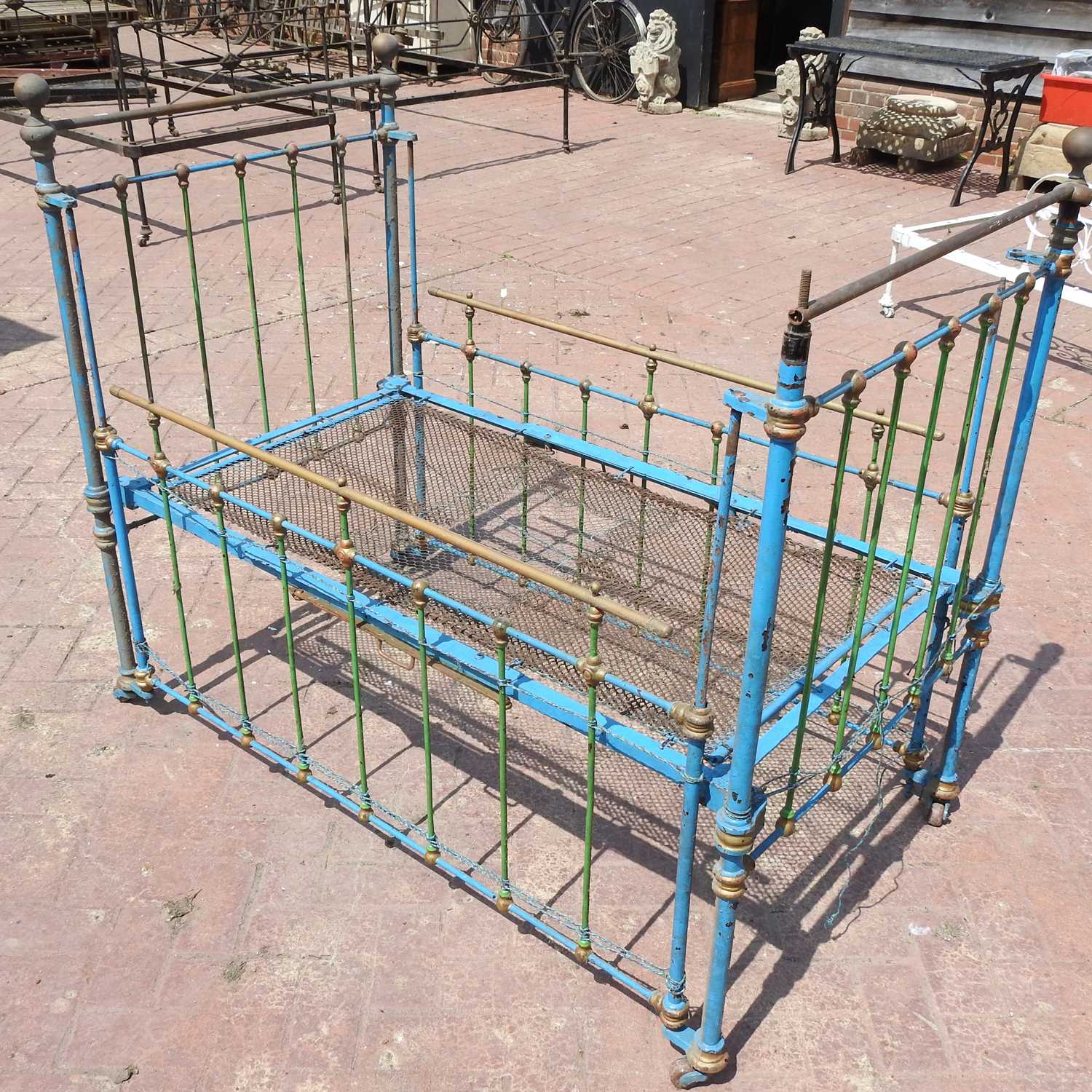 Lot 94 - A Victorian blue painted iron child's cot