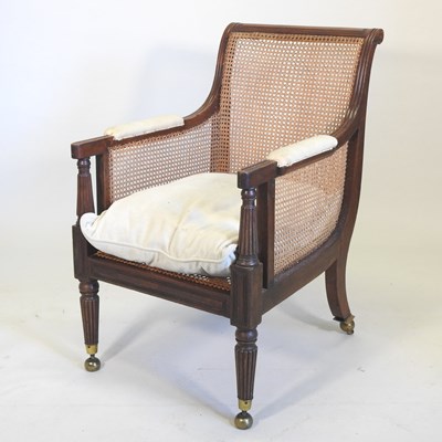 Lot 36 - A Regency mahogany single cane bergere library armchair