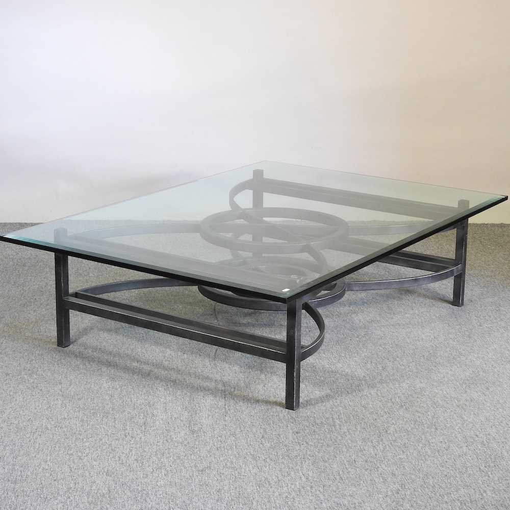 Lot 733 - A glass top coffee table