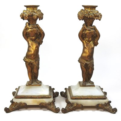Lot 122 - A pair of 19th century French gilt mounted table candlesticks