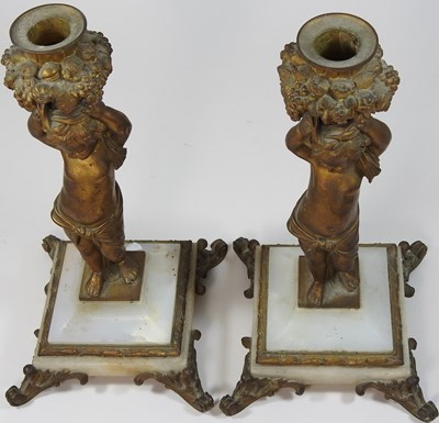 Lot 122 - A pair of 19th century French gilt mounted table candlesticks