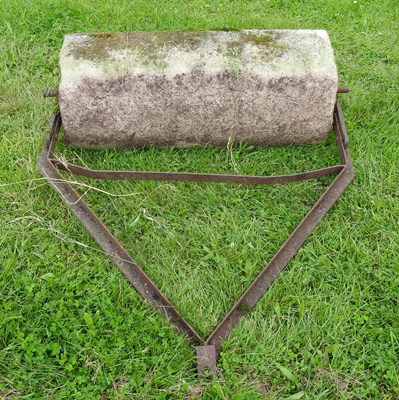 Lot 601 - A heavy flat stone roller, with an iron frame