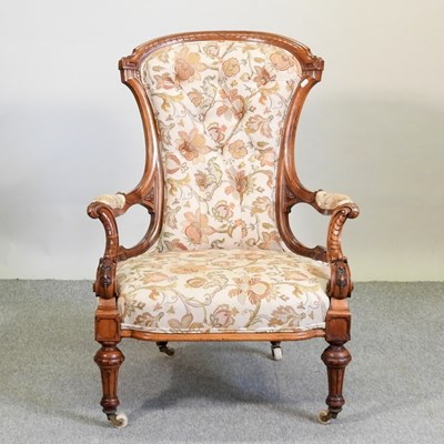 Lot 777 - A Victorian walnut upholstered armchair