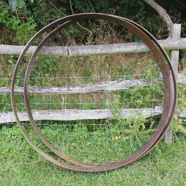 Lot 617 - Two large cart wheel iron tyres