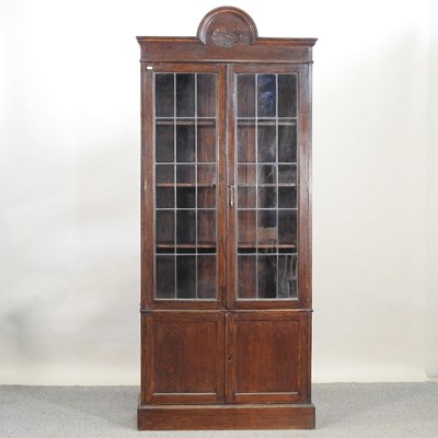 Lot 673 - An early 20th century glazed oak bookcase