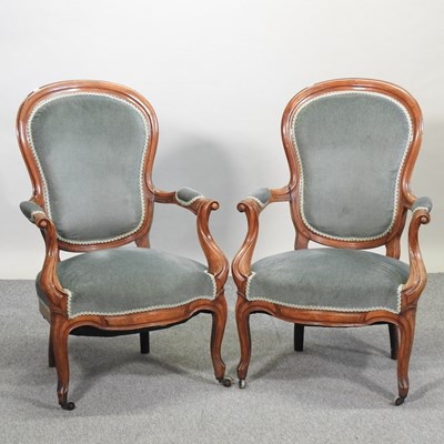 Lot 759 - A pair of Victorian walnut show frame armchairs