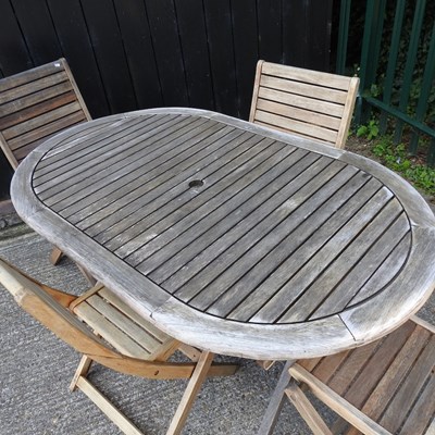 Lot 359 - A hardwood slatted garden table