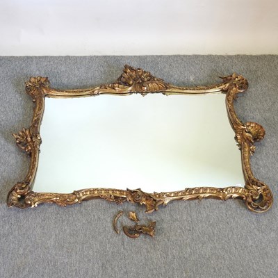 Lot 799 - An ornate 19th century carved and gilt gesso framed wall mirror