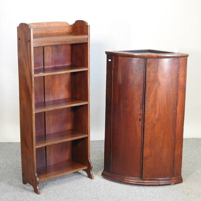 Lot 793 - A 19th century mahogany bow front hanging corner cabinet