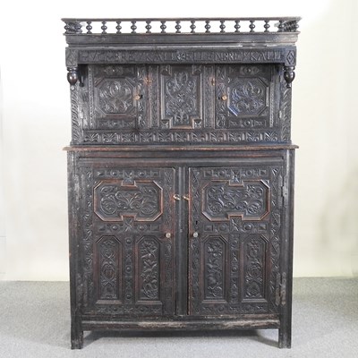 Lot 787 - A 19th century carved dark oak court cupboard