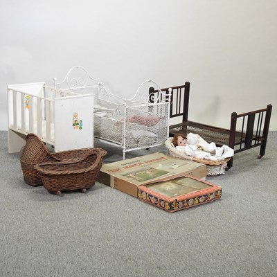 Lot 408 - An antique children's metal toy cot