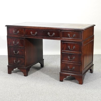 Lot 455 - A reproduction mahogany twin pedestal desk