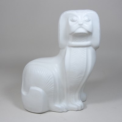 Lot 125 - An Adler white glazed pottery model of a seated dog