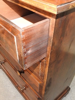 Lot 469 - A modern stained pine chest of drawers