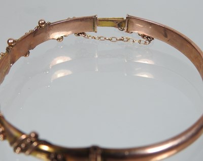 Lot 13 - An early 20th century 9 carat gold bangle