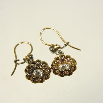 Lot 18 - A pair of unmarked two colour diamond cluster earrings