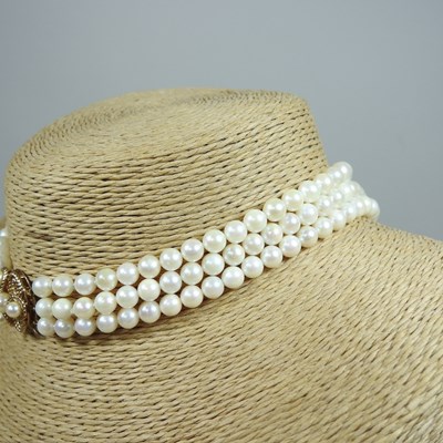 Lot 21 - A 9 carat gold mounted three row cultured pearl necklace