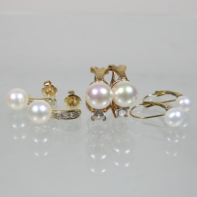 Lot 26 - A pair of 14 carat gold diamond and cultured pearl earrings
